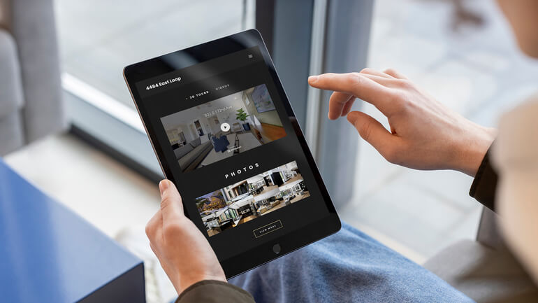 Person viewing a property listing presentation on a tablet with photos and virtual tour details.