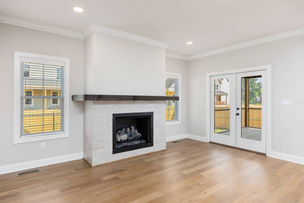 Empty living room with fireplace ready for virtual staging.