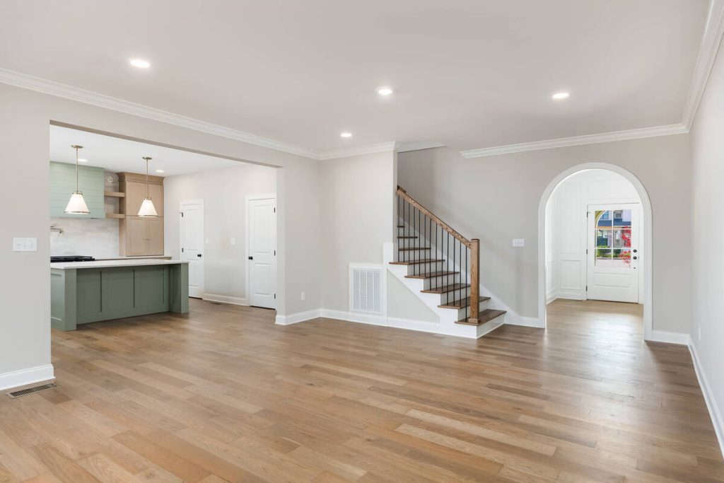 Vacant open-concept living and kitchen area before virtual staging.