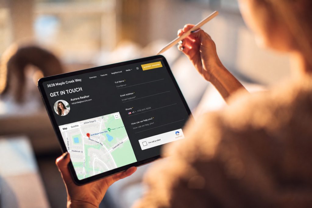Buyer using a tablet to access a real estate property contact page
