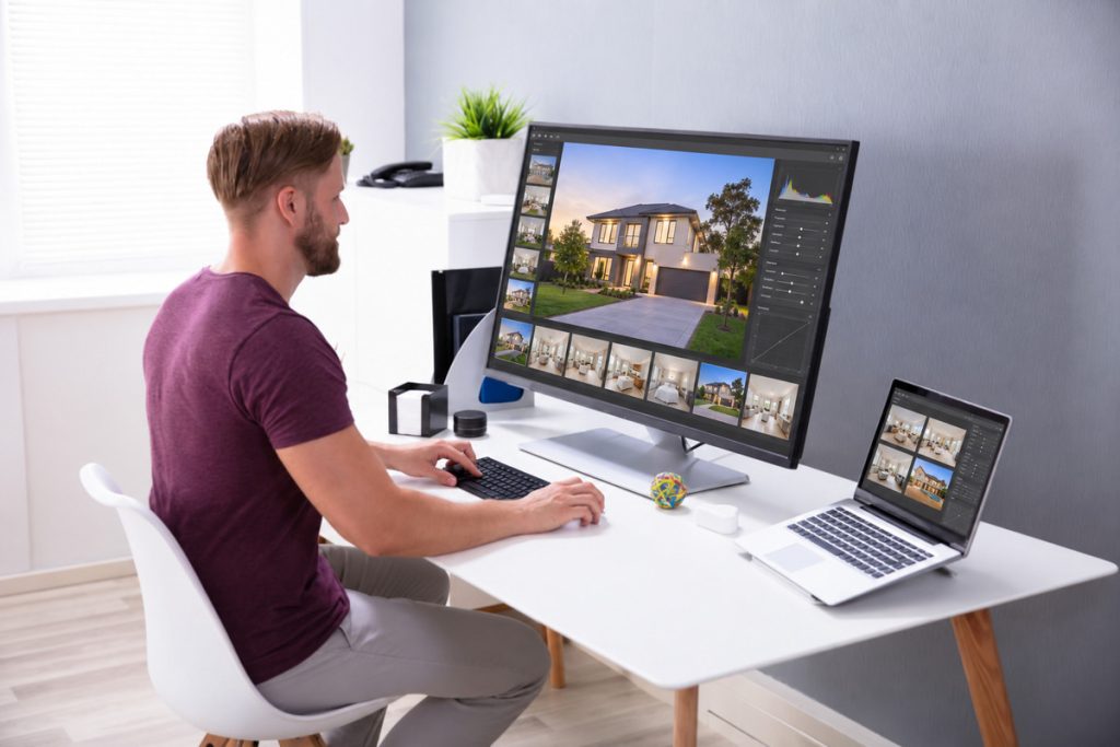 Professional editor working on property images for real estate photo editing pricing