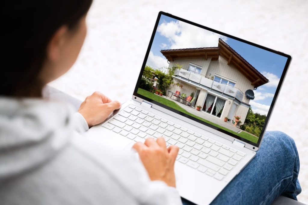 Real estate property photo displayed on a laptop for real estate photo editing pricing
