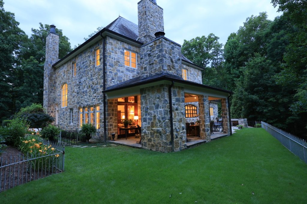 Original exterior photo of a stone house before virtual twilight editing